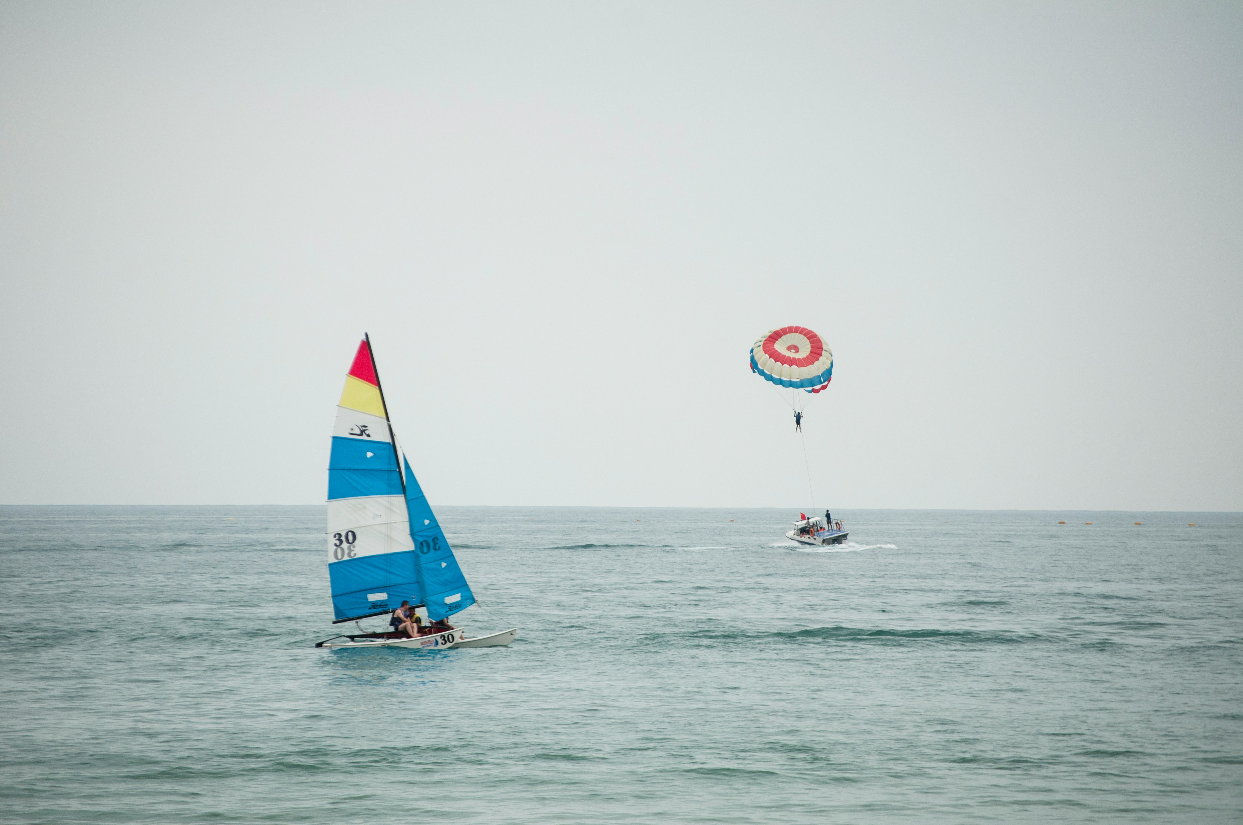 person riding parasailing